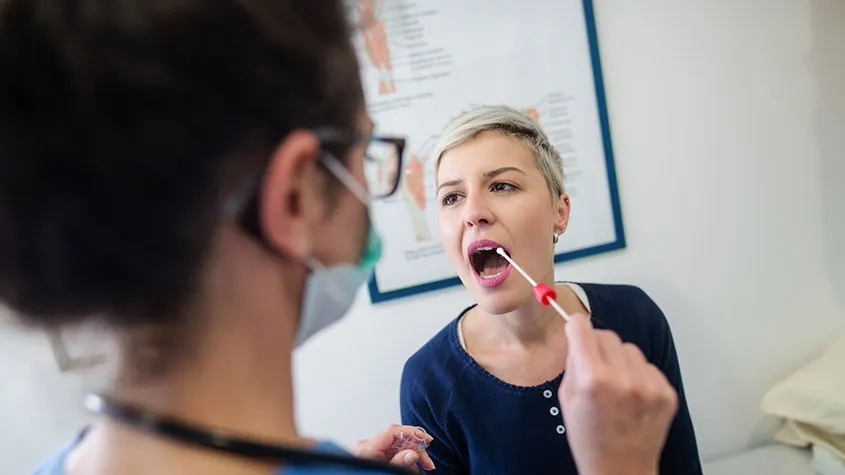 A healthcare worker handles a swab test. Credit: ITV News Central